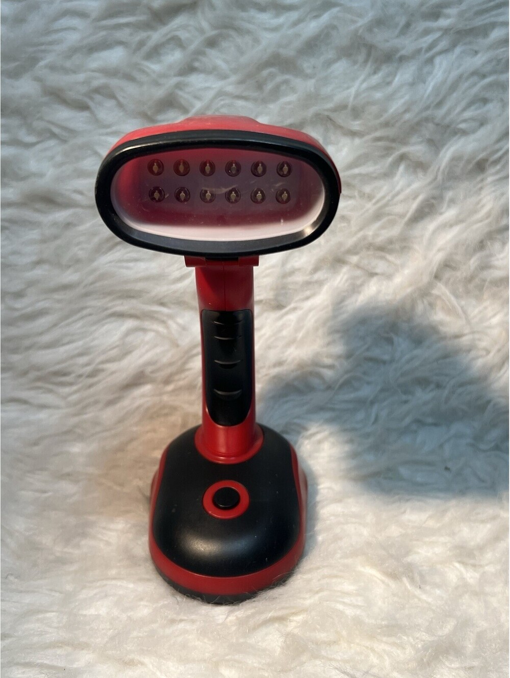 Red Portable, battery-operated desk & reading light with an adjustable head